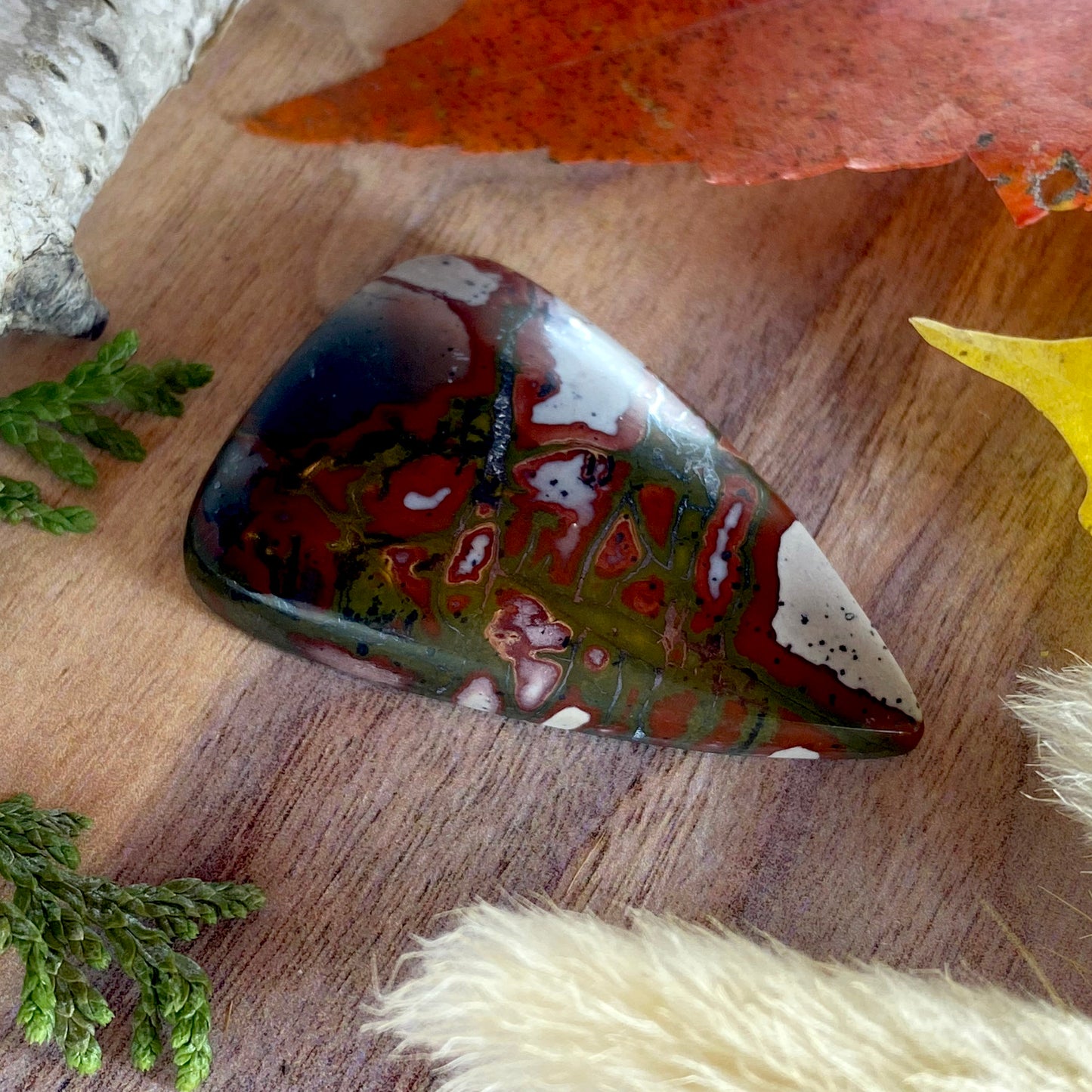 Red and Green Blanket Rhyolite Cabochon Front View II - Stone Treasures by the Lake