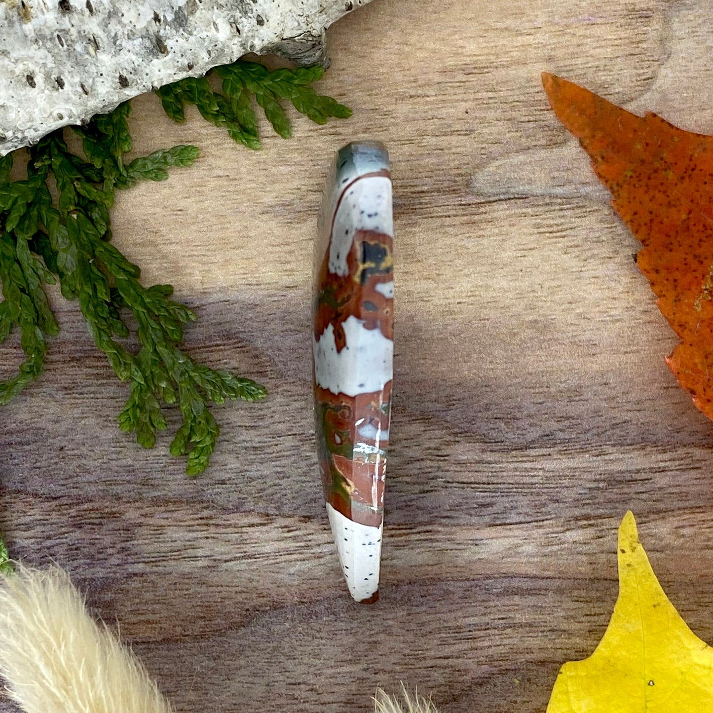 Red and Green Blanket Rhyolite Cabochon Side View - Stone Treasures by the Lake