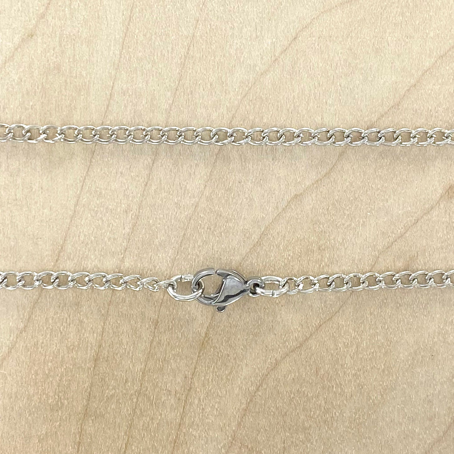 NOTE: The pendant you receive will be similar to the one pictured. Since each Petoskey Stone is unique, each pattern will also be unique.