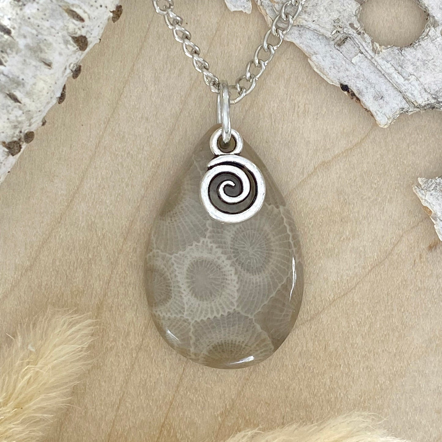 NOTE: The pendant you receive will be similar to the one pictured. Since each Petoskey Stone is unique, each pattern will also be unique.