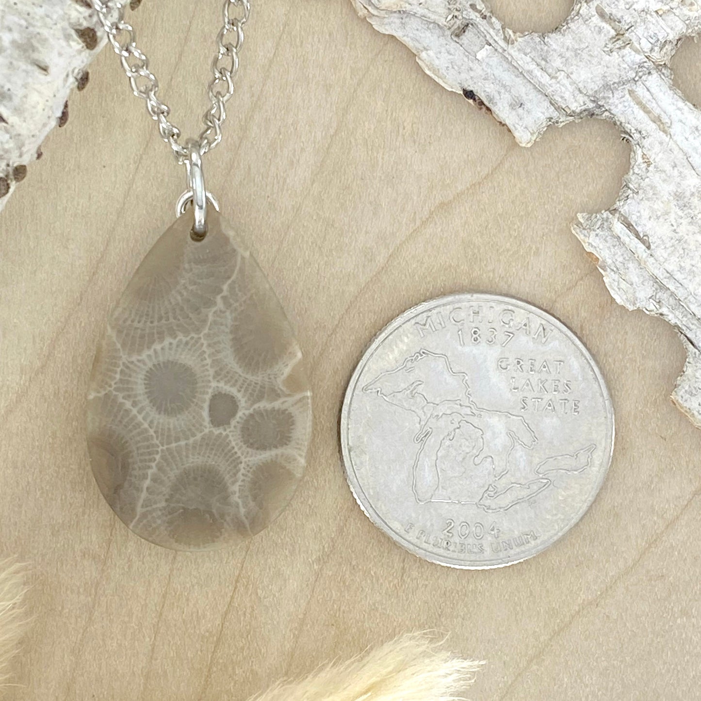 NOTE: The pendant you receive will be similar to the one pictured. Since each Petoskey Stone is unique, each pattern will also be unique.