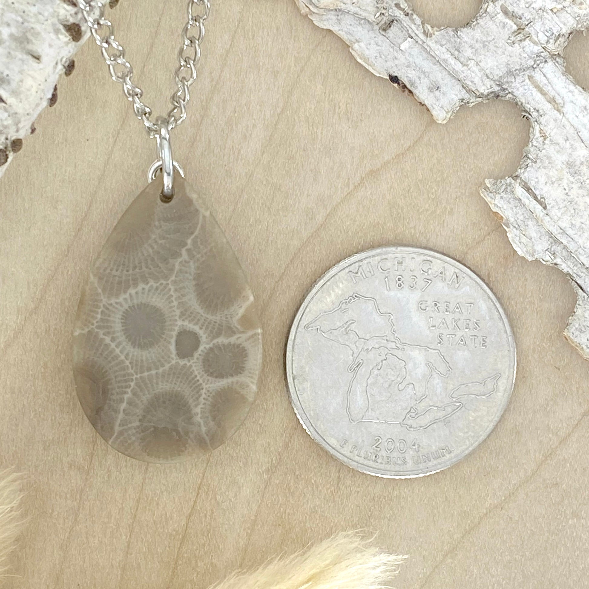 NOTE:  The pendant you receive will be similar to the one pictured.  Since each Petoskey Stone is unique, each pattern will also be unique.