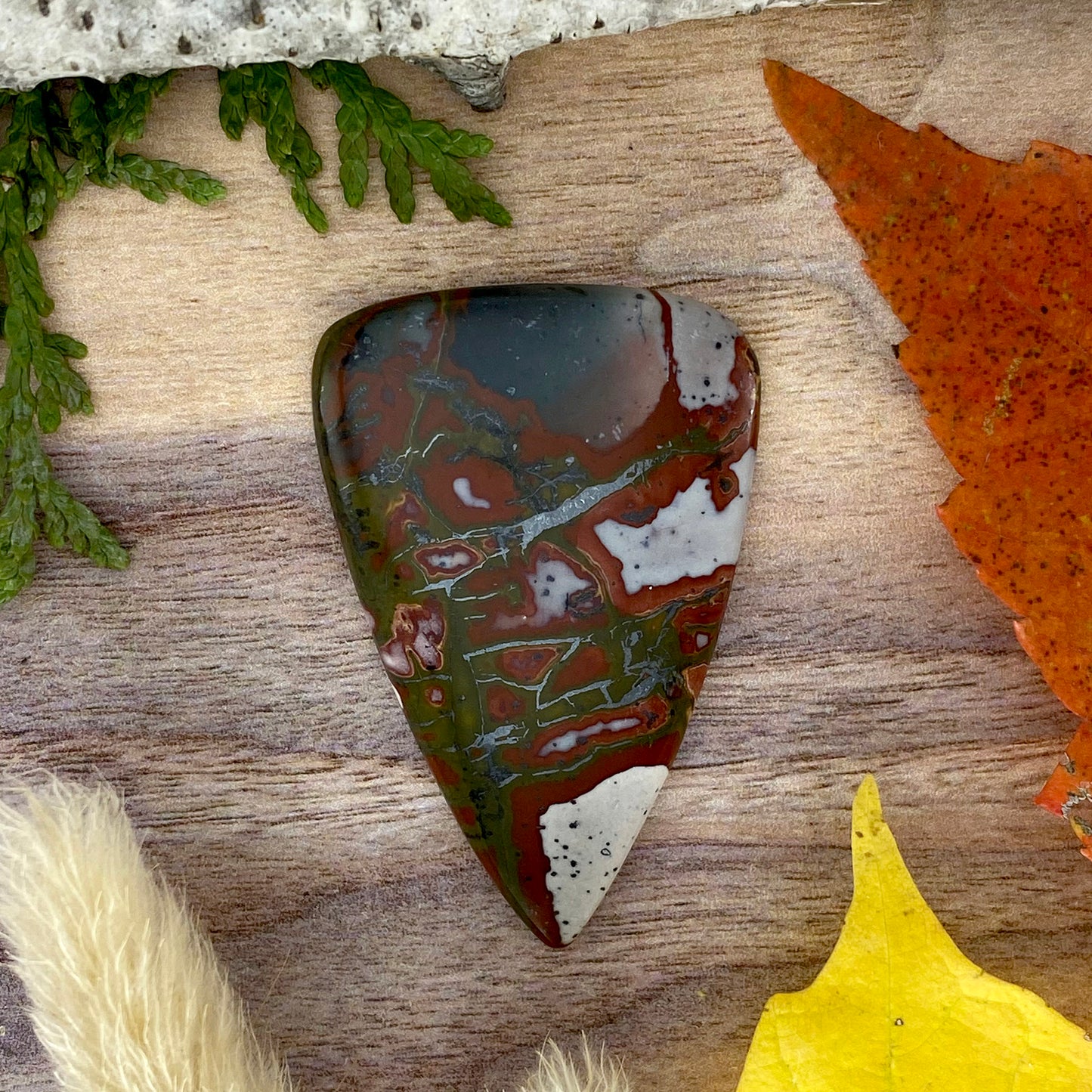 Red and Green Blanket Rhyolite Cabochon Front View - Stone Treasures by the Lake